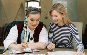 Manager and team member reviewing CliftonStrengths report