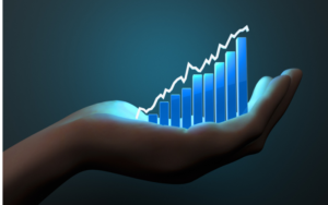 Hand holding a graph with an upward trend